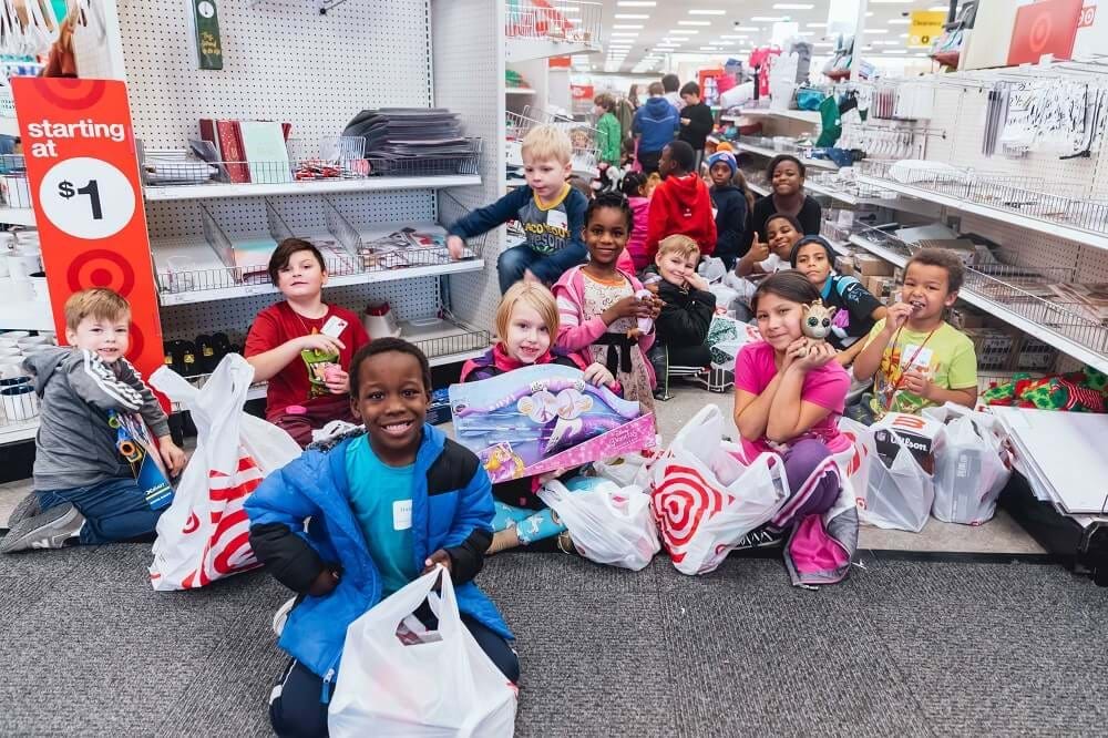 group of kids at holiday shopping spree event