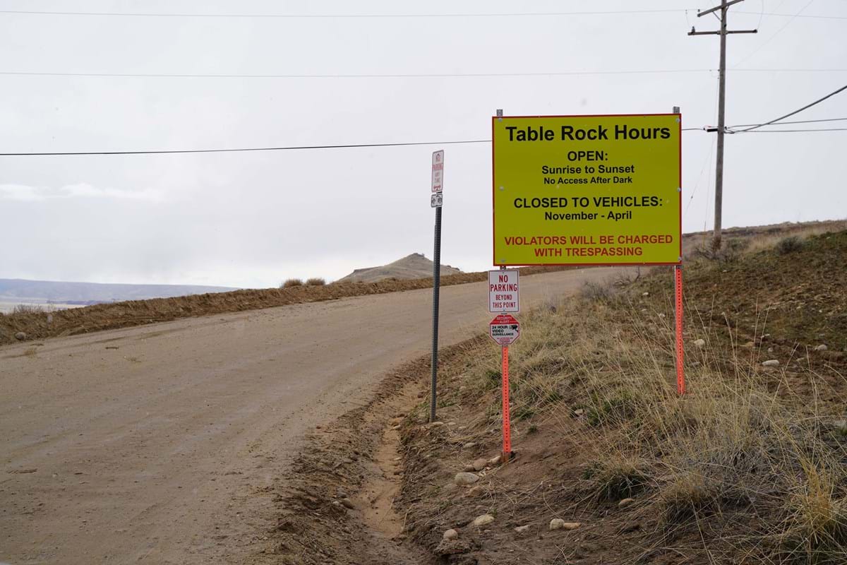 Sign posed on Table Rock Road about open hours