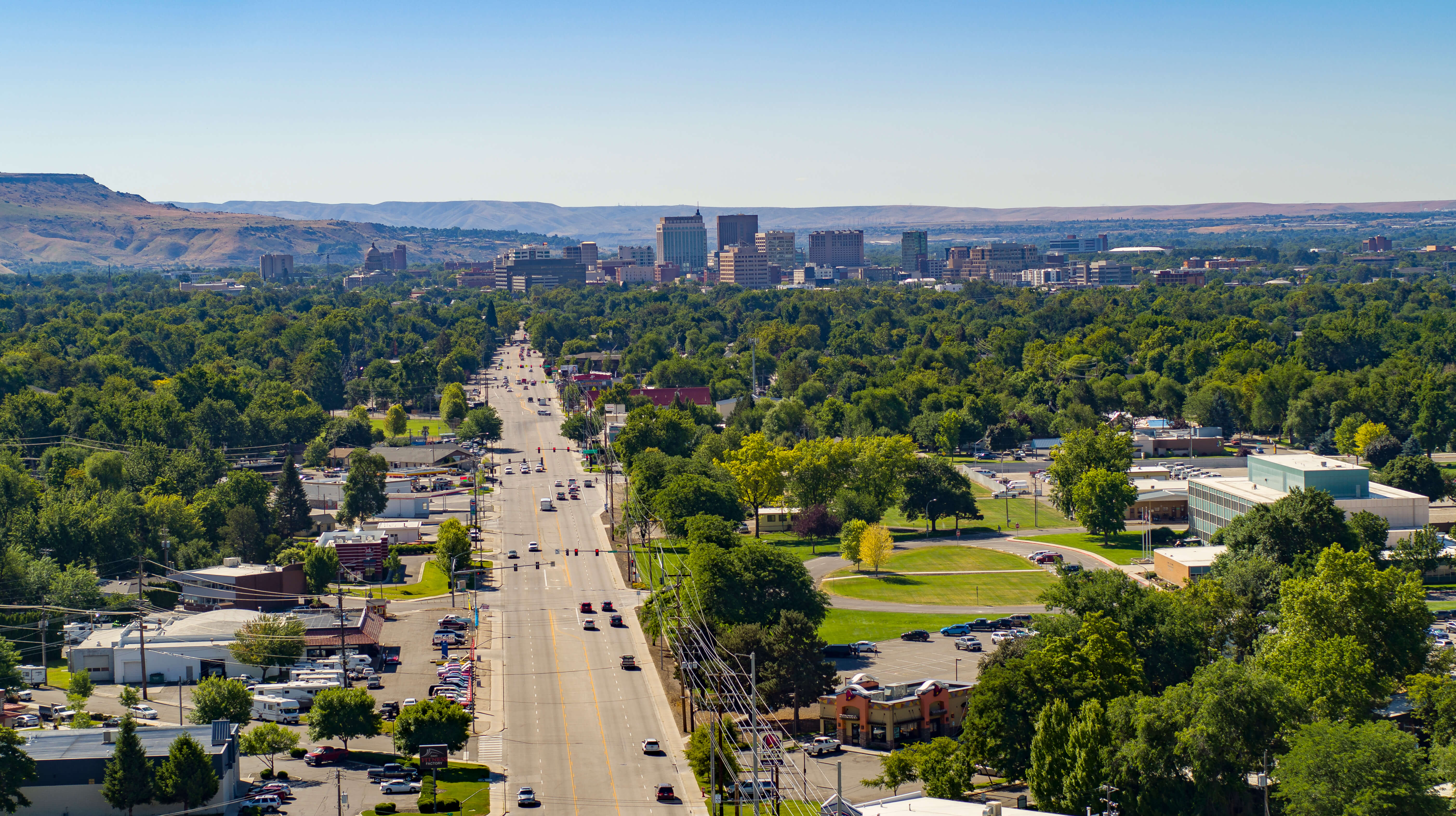 Arial image of state street showing some traffic and trees from above.