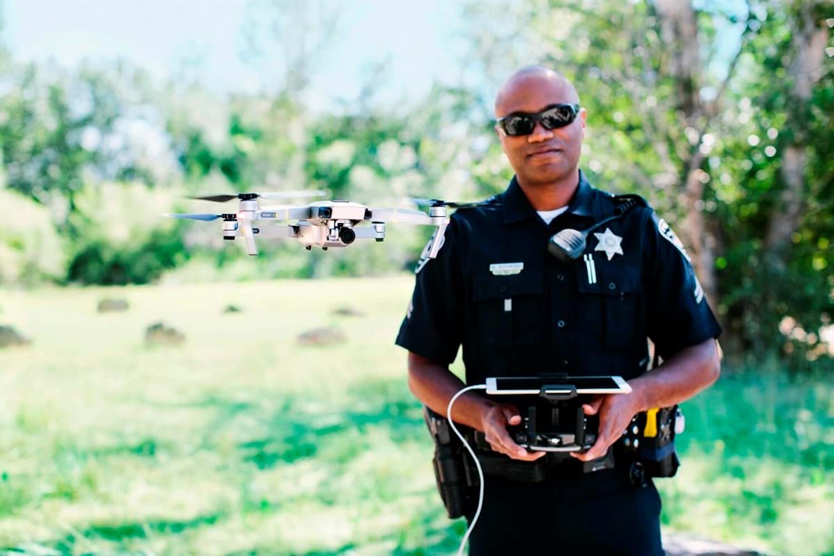 Police officer flying drone