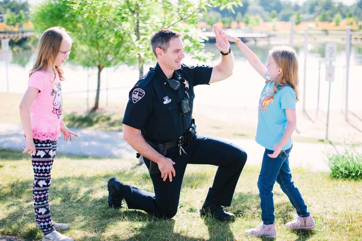 Officer giving a kid a high five