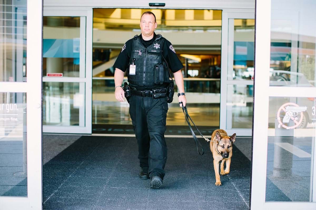 Officer walking with K9 unit