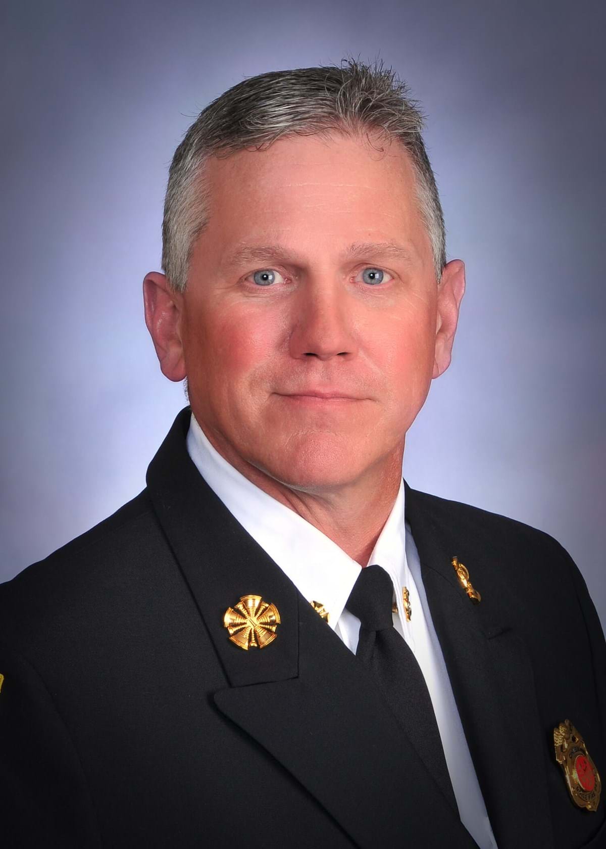 Chief Niemeyer, man with short gray hair and fire chief uniform