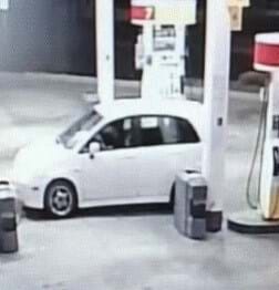 small white car at gas station
