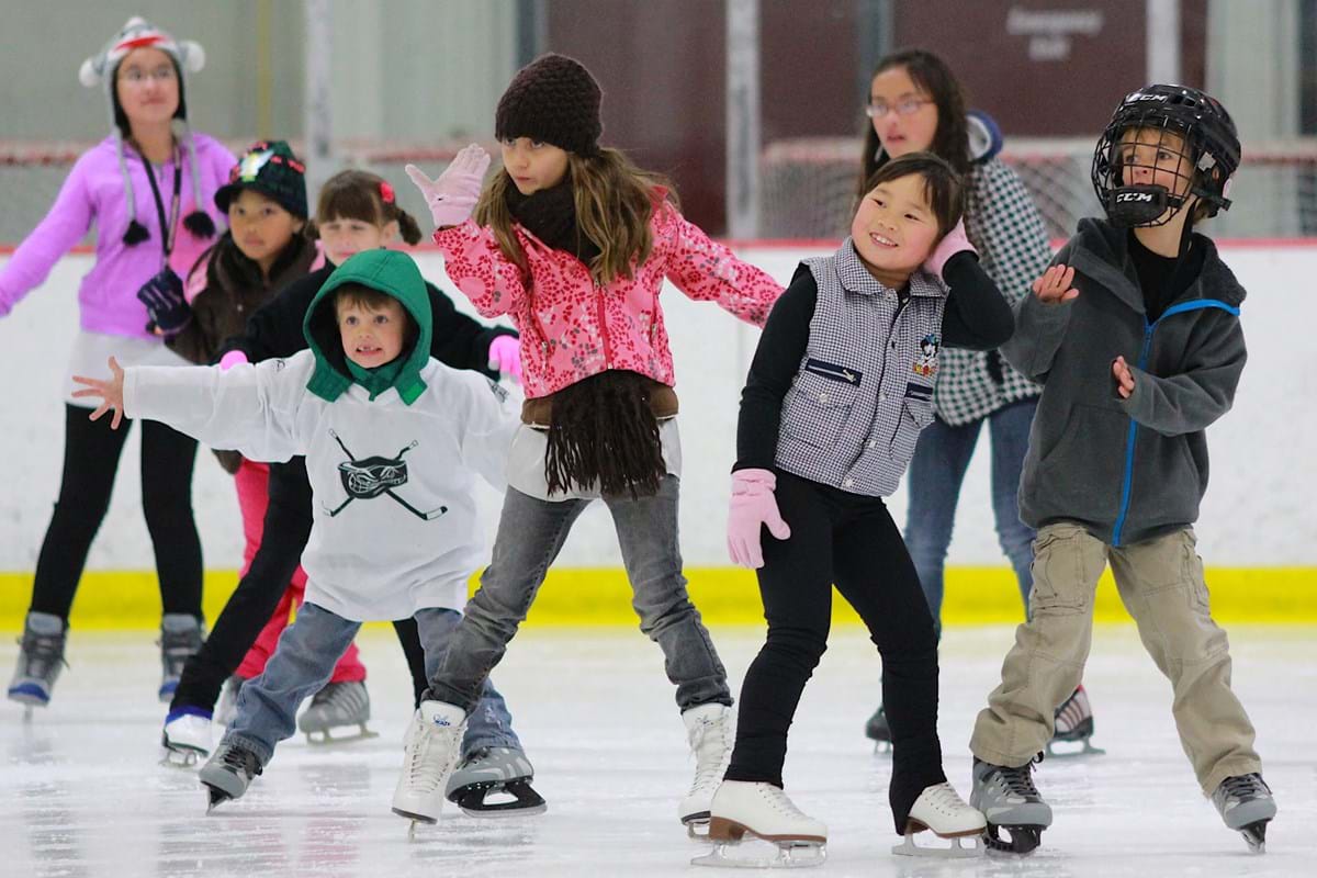 group of kids learning how to skate