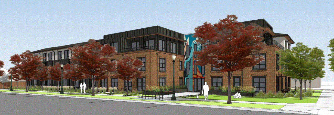 Brown brick apartment building with sidewalk and trees