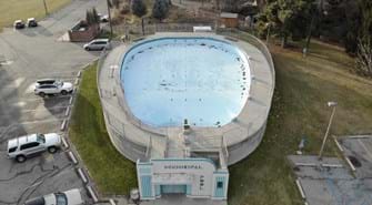Aerial drone photograph of lowell pool with surrounding neighborhood