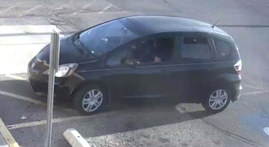 black honda hatchback in a parking lot