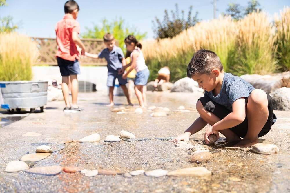kids playing in the water at the boise watershed