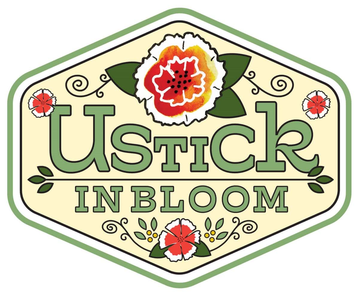 Ustick in Bloom with flowers around the text