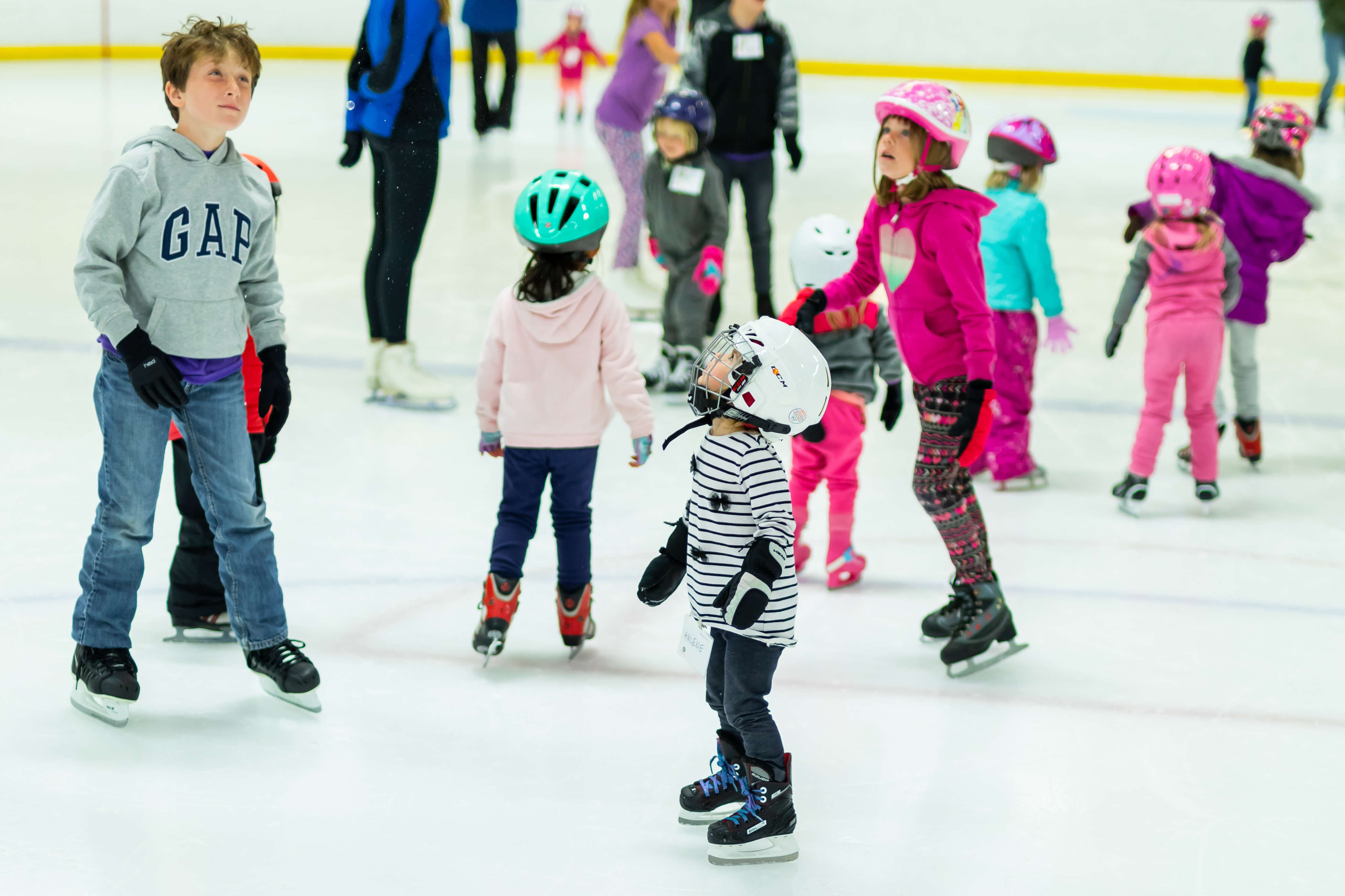 Group of kids learning to ice skate