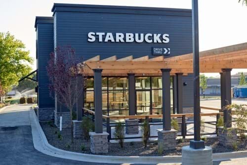 Starbucks coffee building with drive thru and outdoor patio