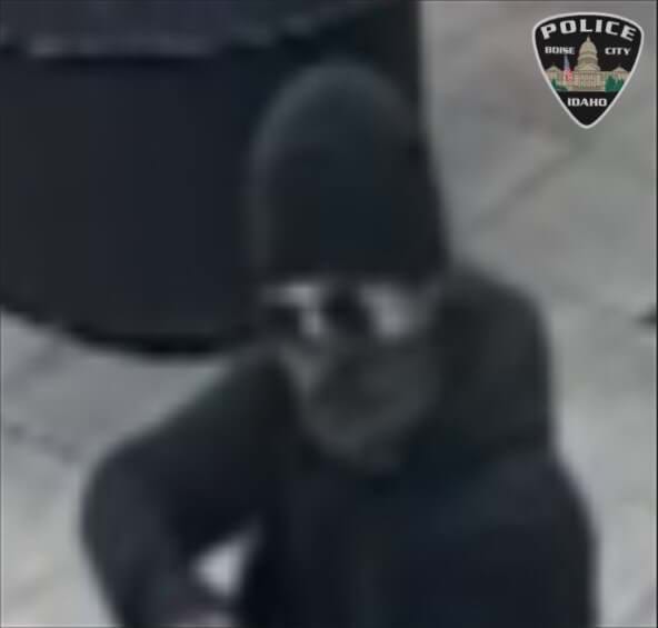 Suspect wearing hoodie, sunglasses, beanie and bandana
