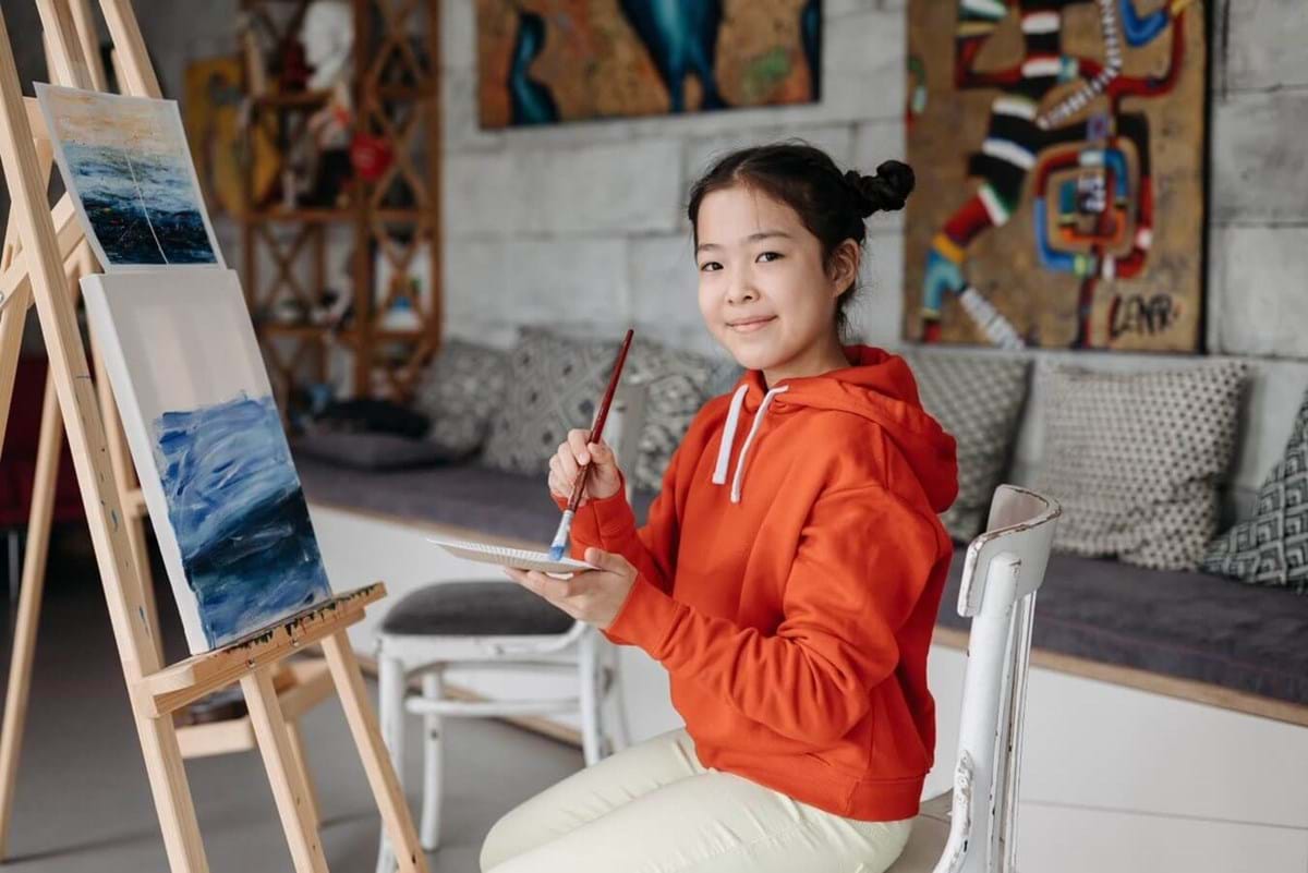 girl taking a painting class