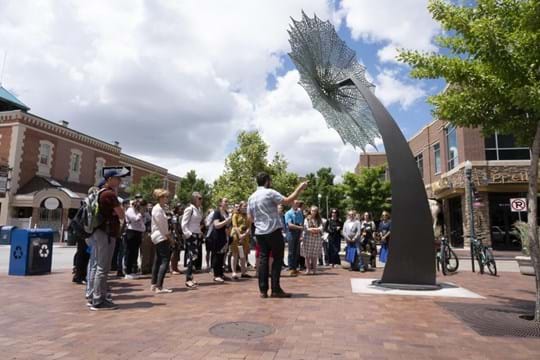 Group of people outdoors looking at public art in Boise