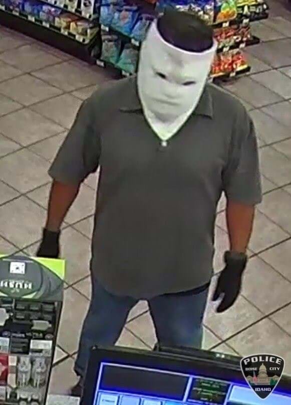 Suspect in white face covering