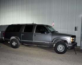  Vehicle Description: The vehicle he was driving is a 1999 gray GMC Yukon. 