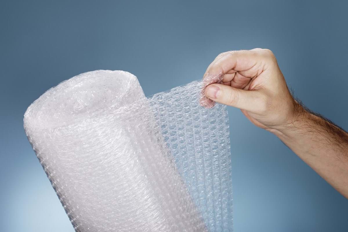 Hand holding up bubble wrap
