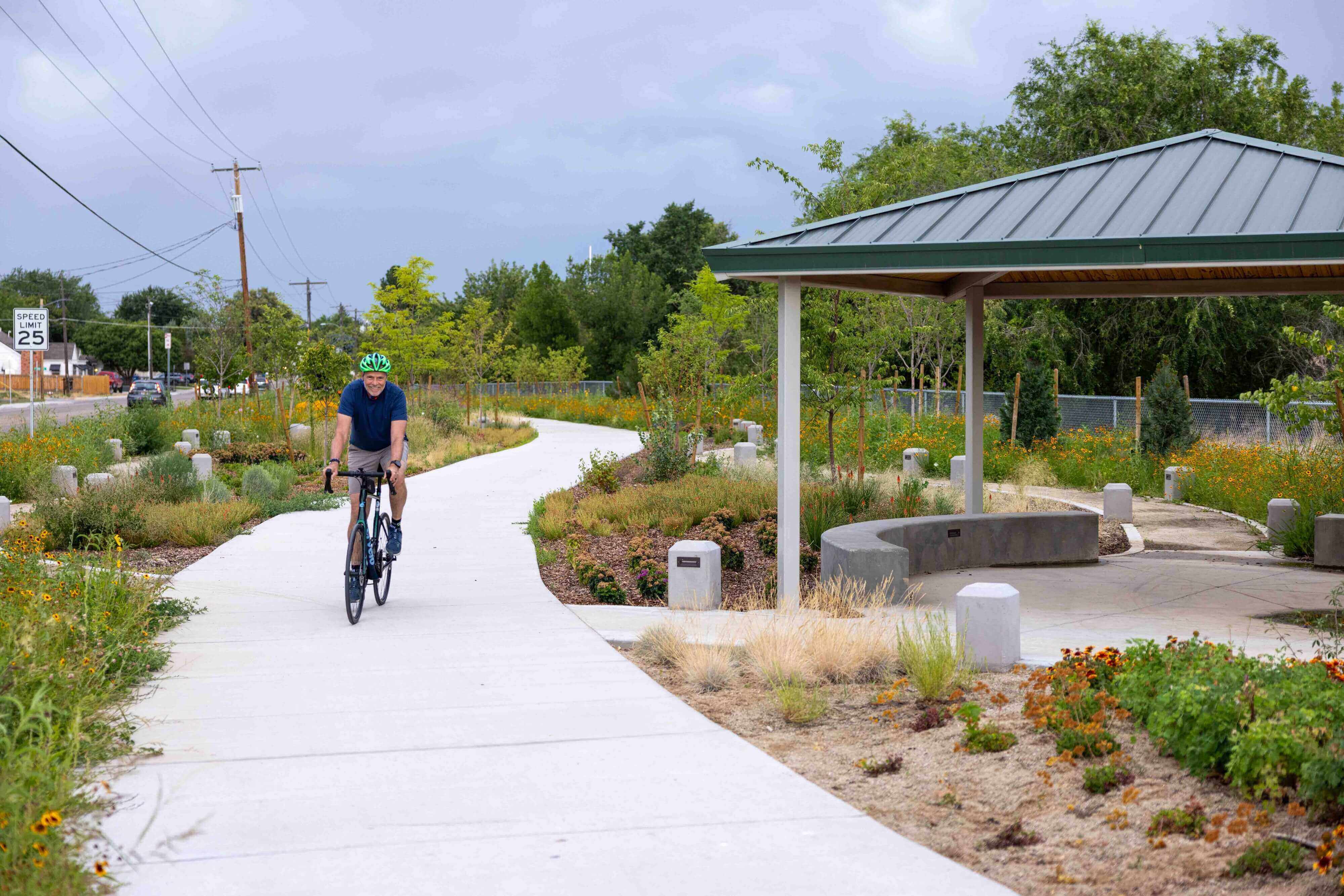 A man riding a bike on Settlers Canal Pathway.