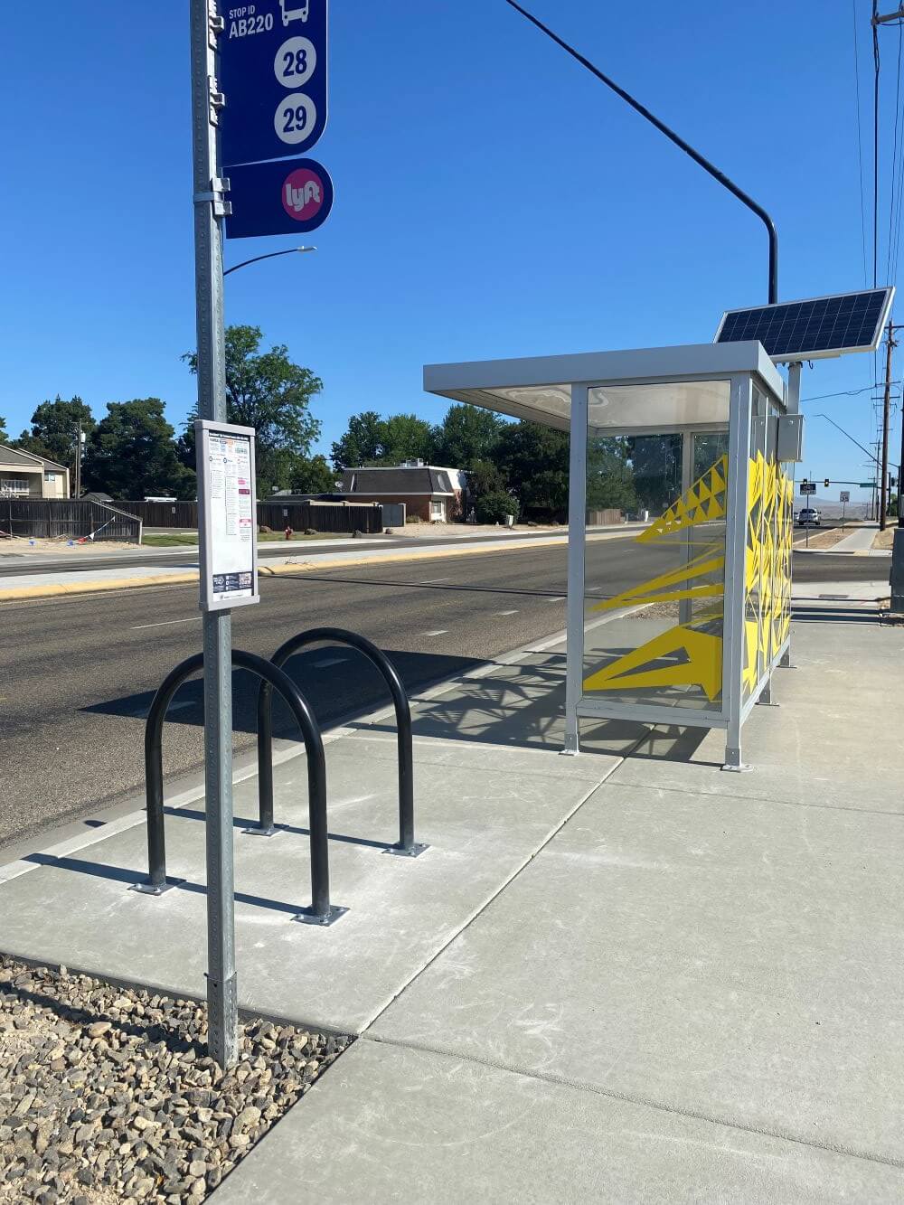A bus stop enhancement on Cole Road during the day.