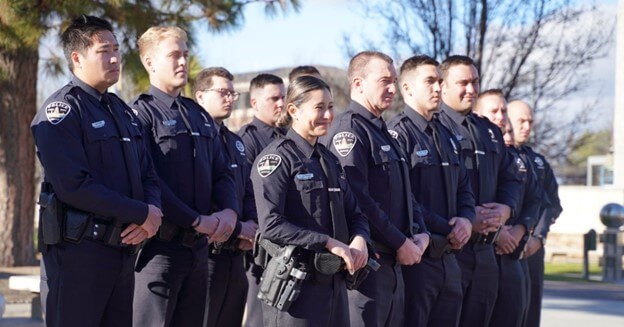 Entry Level Recruits in uniform outside.
