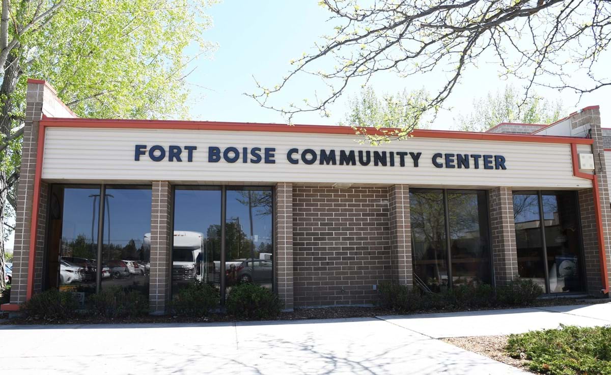 Fort Boise Community Center building with glass windows and blue skies in background