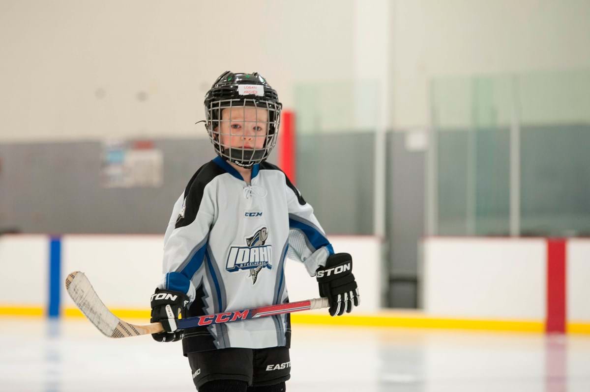 boy playing ice hockey