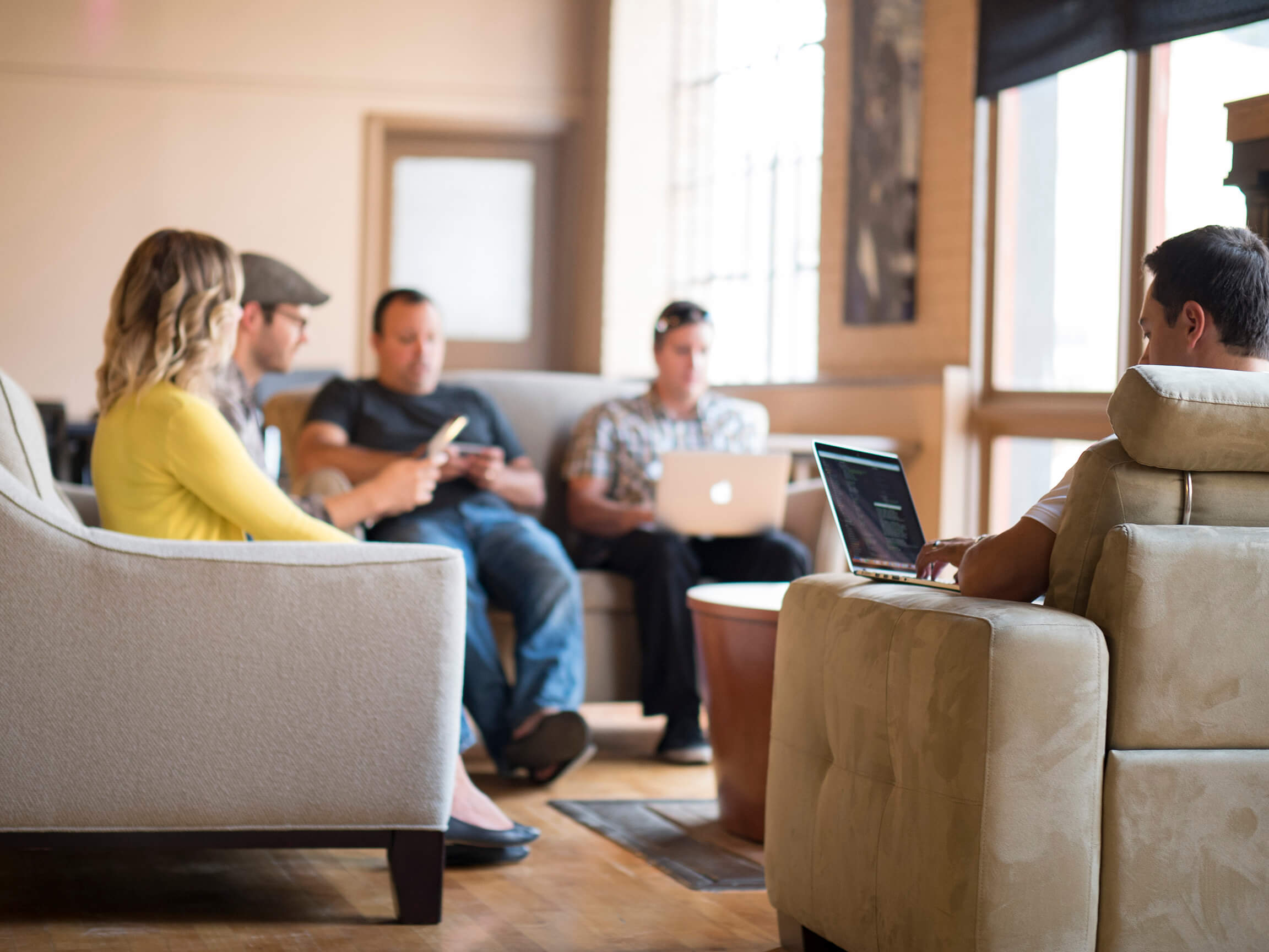 Group sitting together to complete paperwork for a permit.