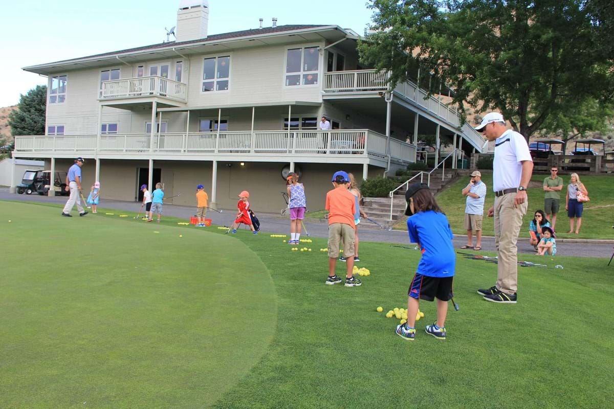 youth putting at quail hollow golf course