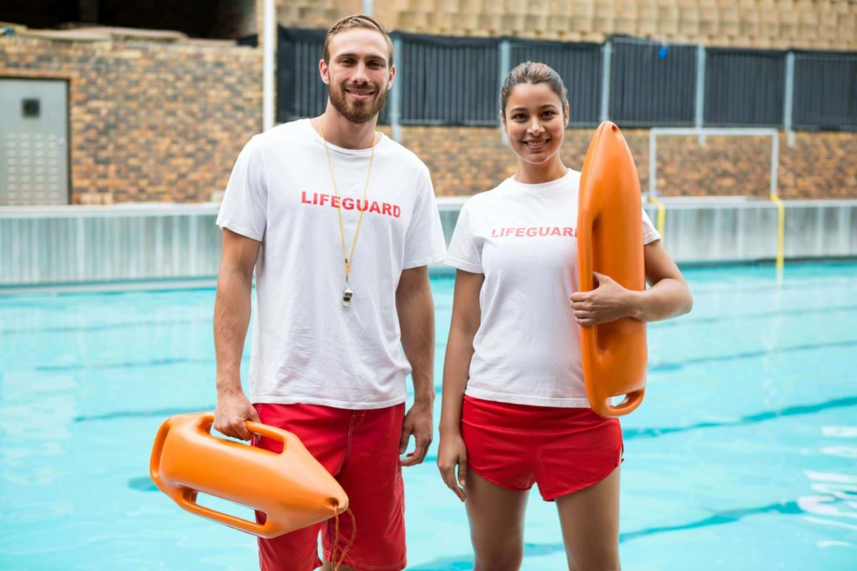 man and woman lifeguard at a pool