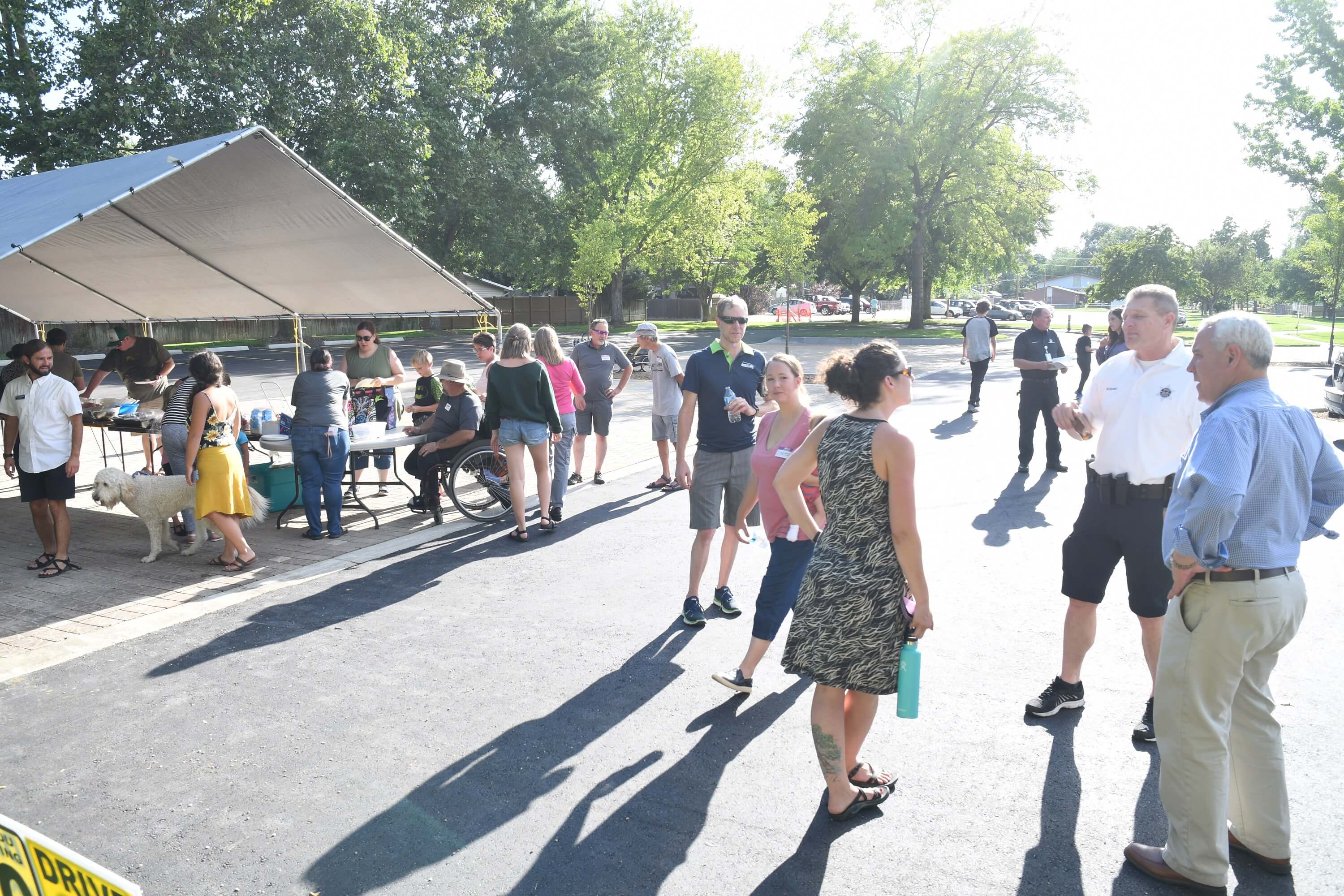 A group of people standing outside talking