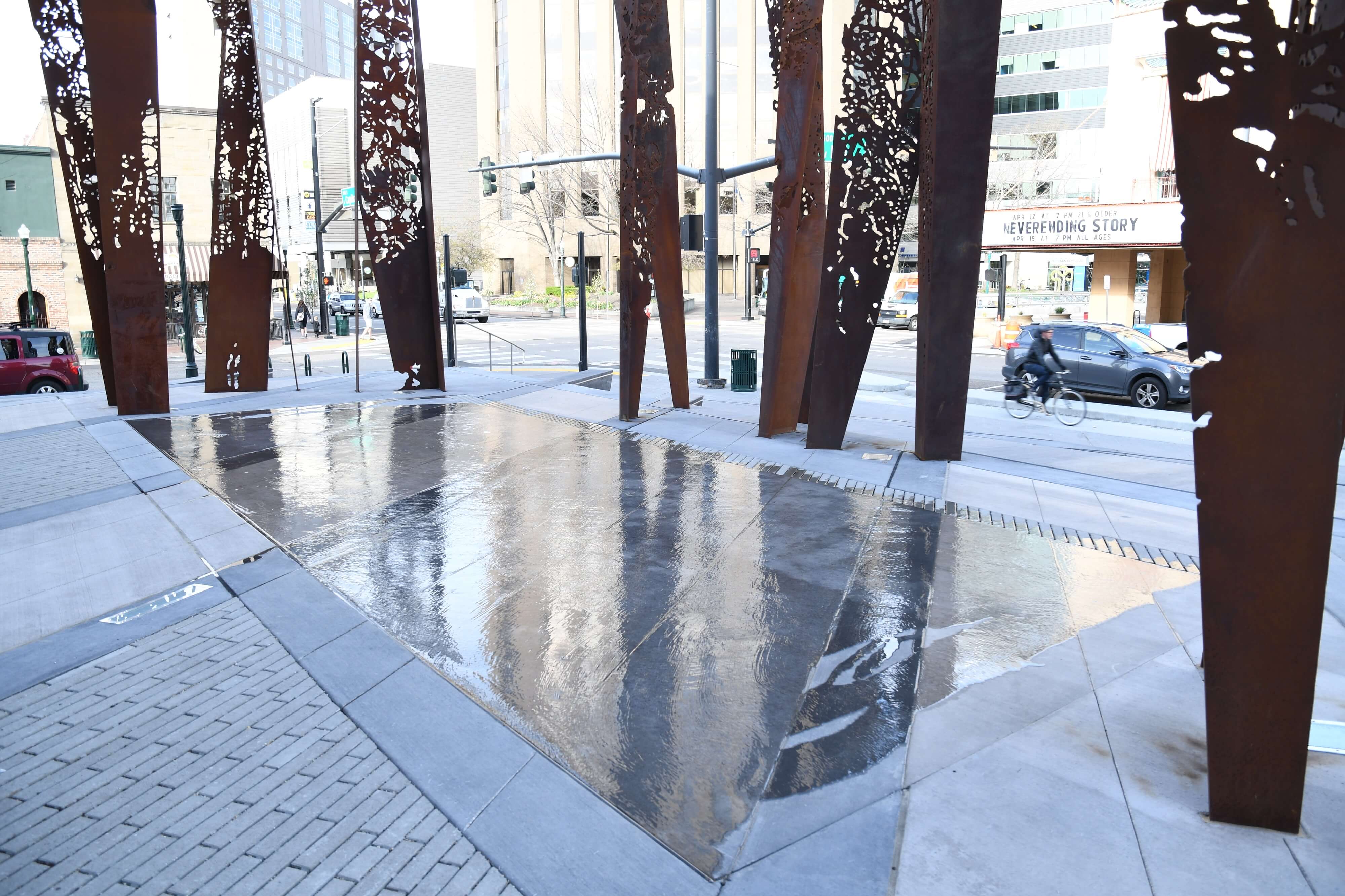 Metal pillars on City Hall Plaza surrounding water feature