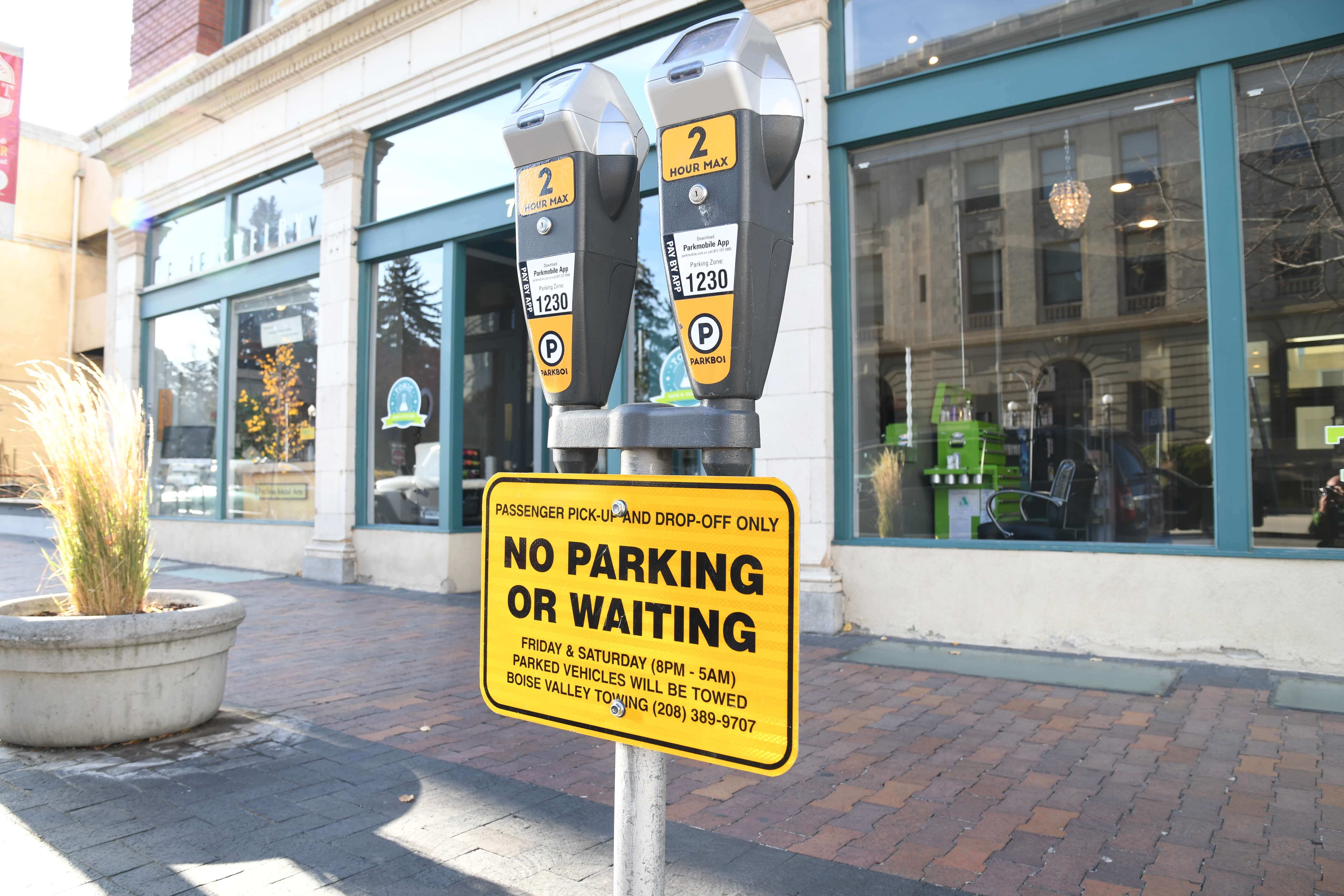 8th Street in downtown Boise with cars parked on either side.