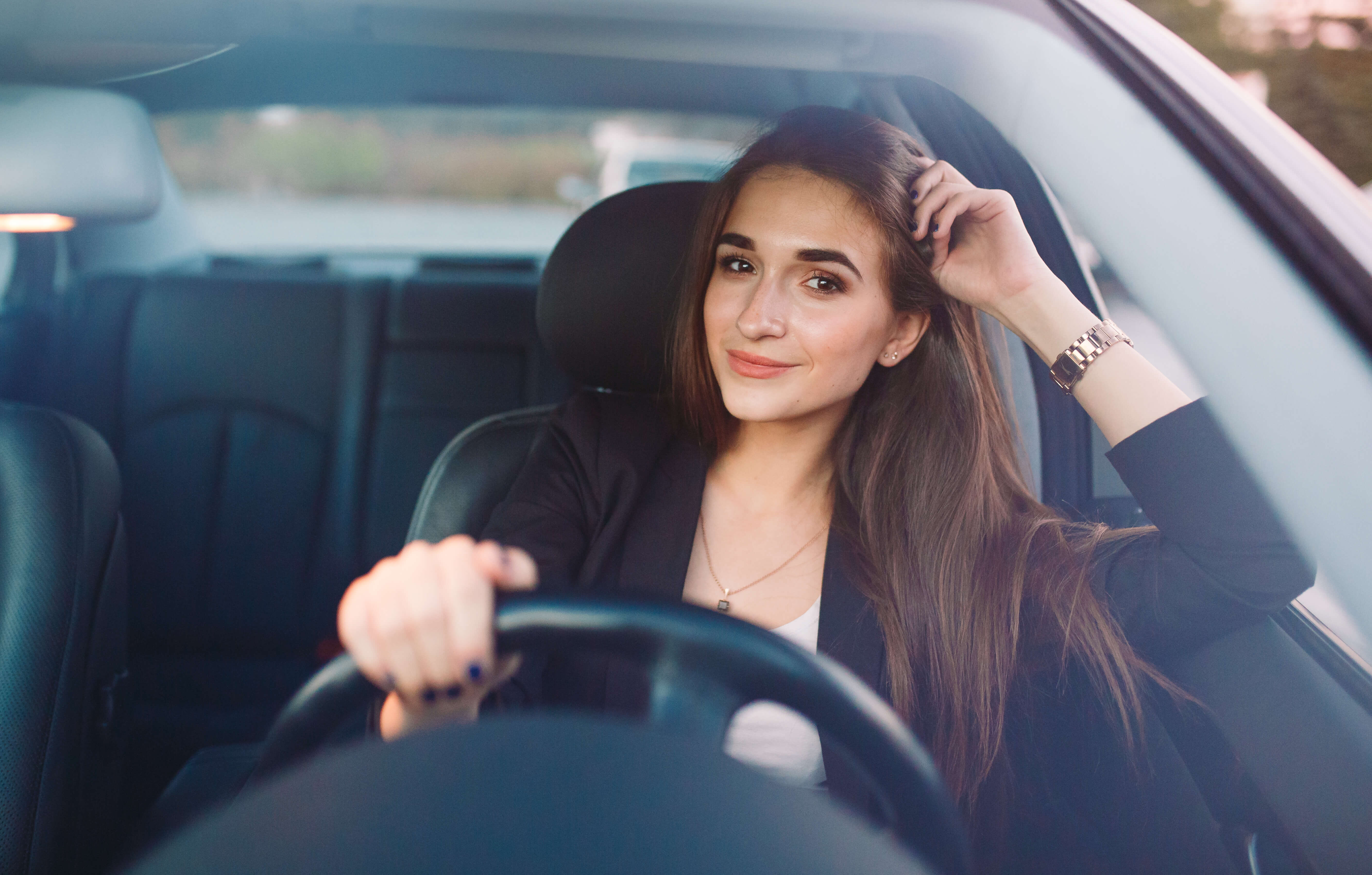 Young woman driving a car