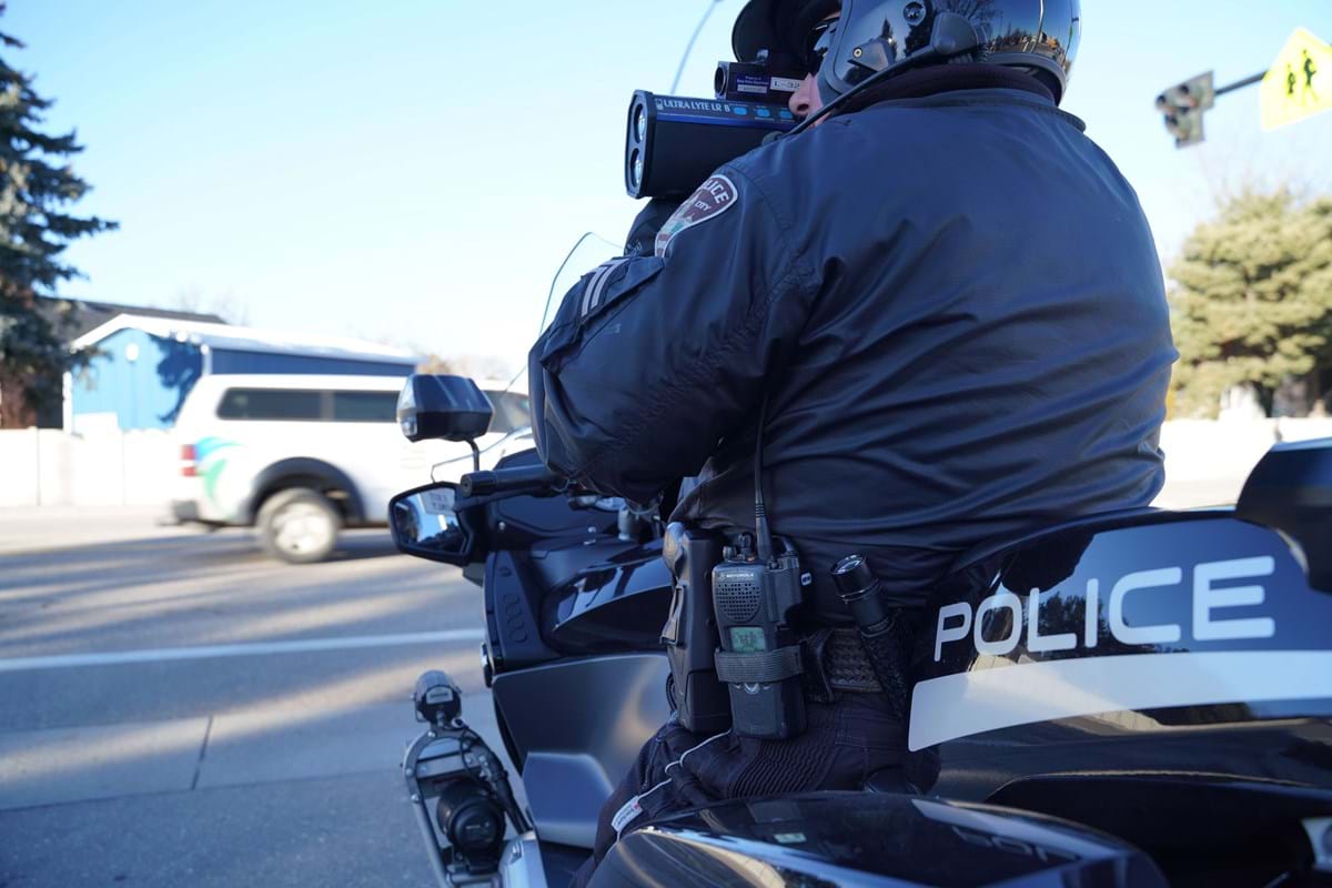 Police motorcycle officer with radar gun